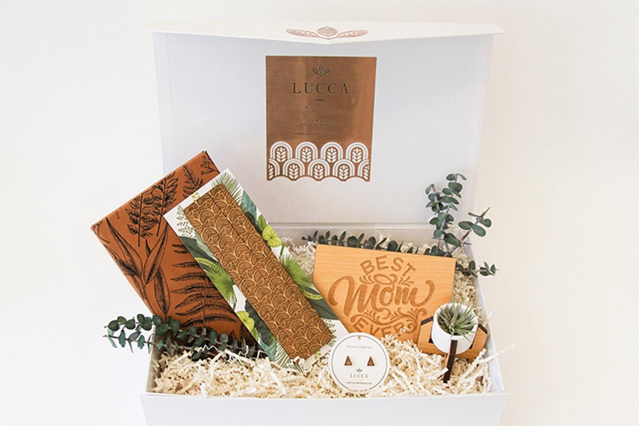 Mom Gift Box from Lucca
Lucca laser workshop in Findlay Market has put together this gift box for mom featuring an engraved faux leather journal, wood bookmark, wooden &#147;Best Mom Ever&#148; card, mini ceramic planter and air plant and wood stud earrings for $62.
Photo via luccaworkshop.com
