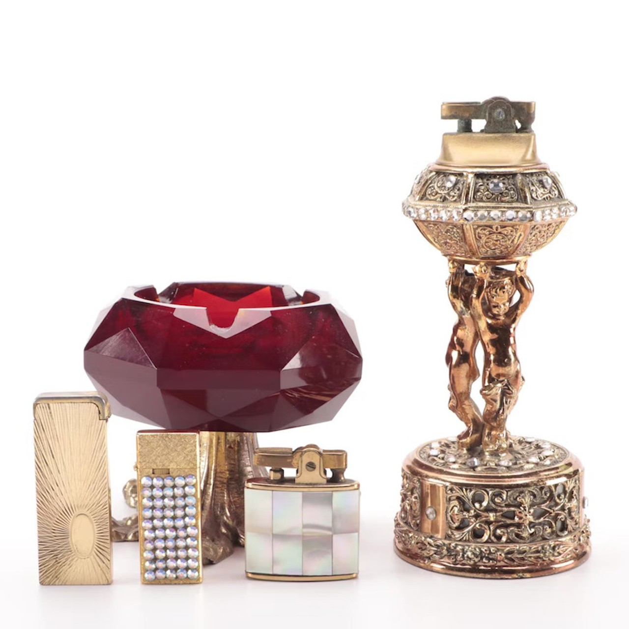 Pedestal Glass Ashtray with Table and Other Lighters
Be the star of your smoking circle’s Secret Santa. These vintage Japanese smoking accessories are a stylish upgrade from your run-of-the-mill Urban Outfitters ashtray. The dramatic, gilded table lighter even plays music.