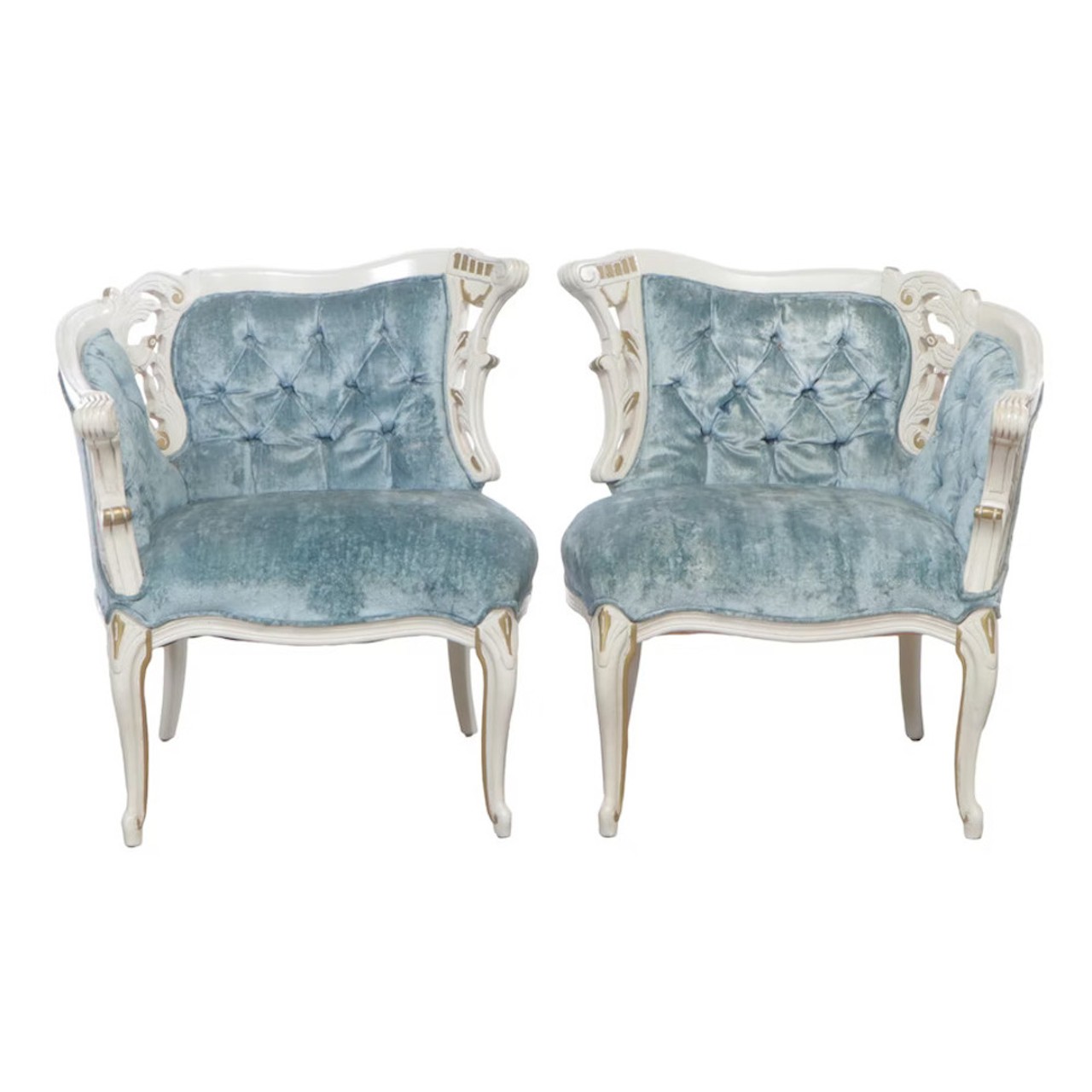 Two Louis XV Style Painted, Parcel-Gilt, and Buttoned-Down Corner Armchairs
For the bold and sexy on your list, these one-of-a-kind accent chairs are showstoppers. Show up to the holiday party with a bow on these chairs and an arsenal of polaroids. You’ll want to be ready to capture vivid candids of your friends sipping their eggnog on the icy winter-blue velvet.