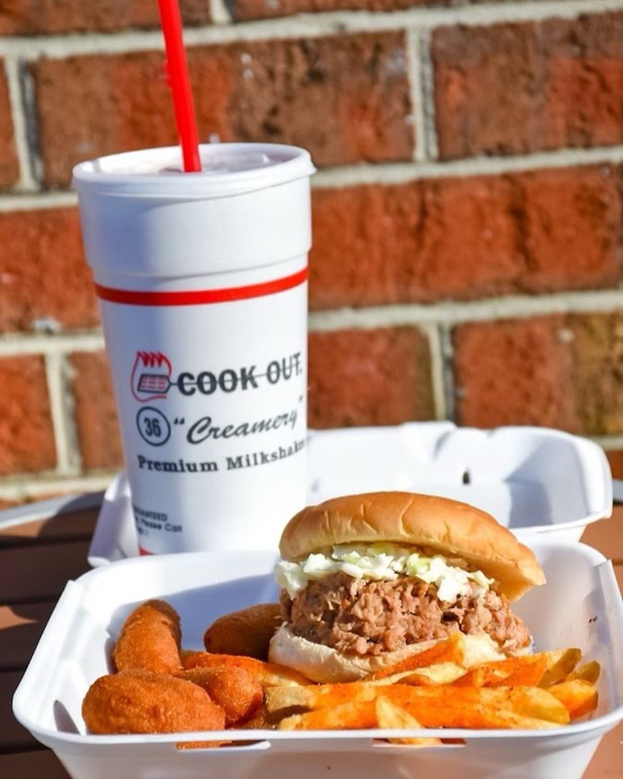 Cook Out
Founded in Greensboro, in 1989, Cook Out was a chain that operated only in North Carolina until 2010 when it expanded into South Carolina. And in the last 12 years, it’s grown considerably and now has locations throughout the southern United States, including in nearby Lexington. Cook Out prides itself on its char-grilled hamburgers and chicken sandwiches, which you can get in a range of “styles,” like the Cook Out Style burger, which comes with homemade chili, slaw, mustard and onion or the Cajun Style chicken sandwich, which comes with Cajun seasoning, Texas Pete hot sauce, lettuce tomato and mayo. Cook Out’s menu also includes hot dogs, hush puppies, BBQ sandwiches and plates and more. You can also do a Tray, or a combo, and get an entree, two sides and a drink. And we need to take a second to talk about their shake menu: Their list comes with nearly 40 flavors with everything from your classic vanilla or banana to five different kinds of cheesecake flavors, red cherry and pineapple.