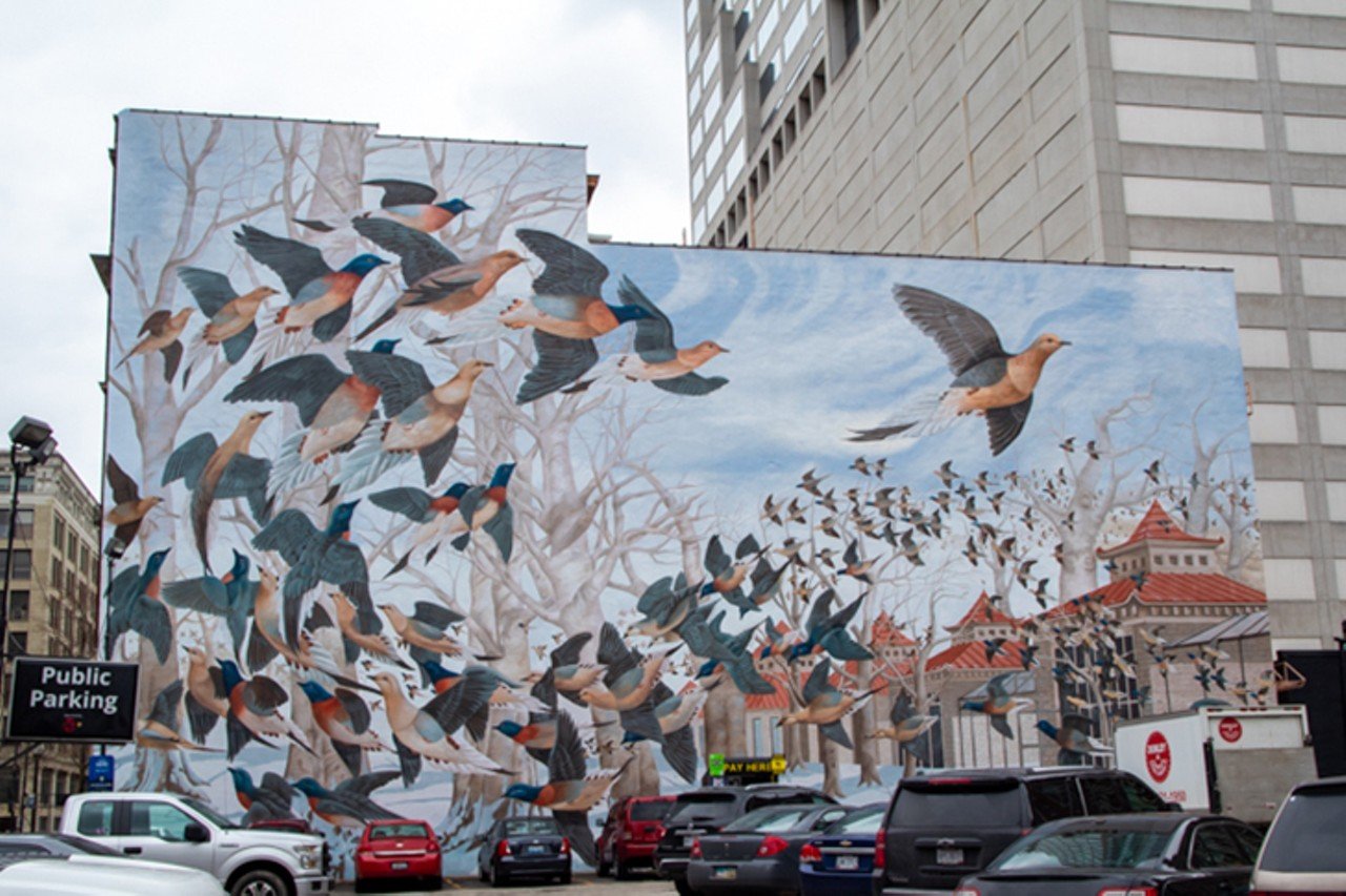 The passenger pigeon went extinct in Cincinnati
Now extinct, the passenger pigeon was once the most common bird in North America. Martha, the last known passenger pigeon, died at the Cincinnati Zoo in 1914. If you head down to 15 E. Eighth St. downtown, you can see a large mural dedicated to her. The ArtWorks project, designed by John A. Ruthven — "the 20th century Audubon" — and based on one of his original works, shows Martha and a flock of passenger pigeons flying over Bird Run at the Cincinnati Zoo and is a wall-sized reminder of the importance of conservation.