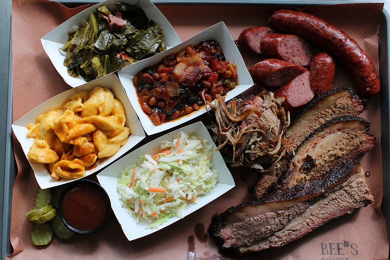 Bee’s Barbecue
5910 Chandler St.; 1403 Vine St., Over-the-Rhine
Bee’s believes good barbecue takes time and that smoking meat is an art – one they practice every day with patience and passion, using high-quality and locally sourced ingredients – even the wood they use is locally sourced. What results from that patience and dedication is a menu filled with tender, fresh barbecue you can buy by the half-pound or pound, on a sandwich or as a plate complemented with sides like creamy mac ‘n cheese, sticky BBQ beans and sweet honey cornbread. If you have any room left for dessert (or if you just want to power through), you won’t want to miss Bee’s Bourbon Peach Cobbler, crafted with bourbon- and brown sugar-laced peaches with a sugar crumble crust, or proprietor Bee’s personal favorite: the banana pudding – made with fluffy layers of fresh bananas, whipped cream and vanilla wafer cookies.