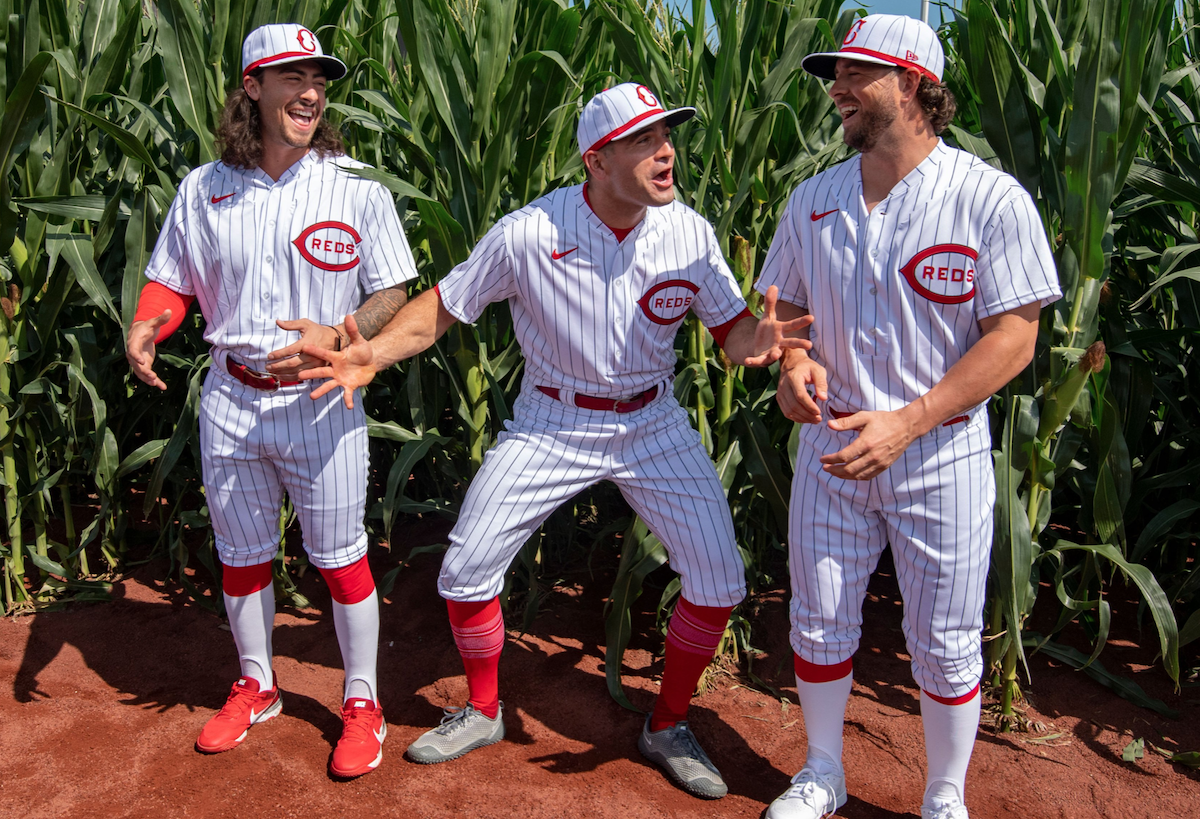 (L-R) Cincinnati reds second baseman Jonathan India, first baseman Joey Votto and former infielder Kyle Farmer prepare for the MLB Field of Dreams game in 2022.
