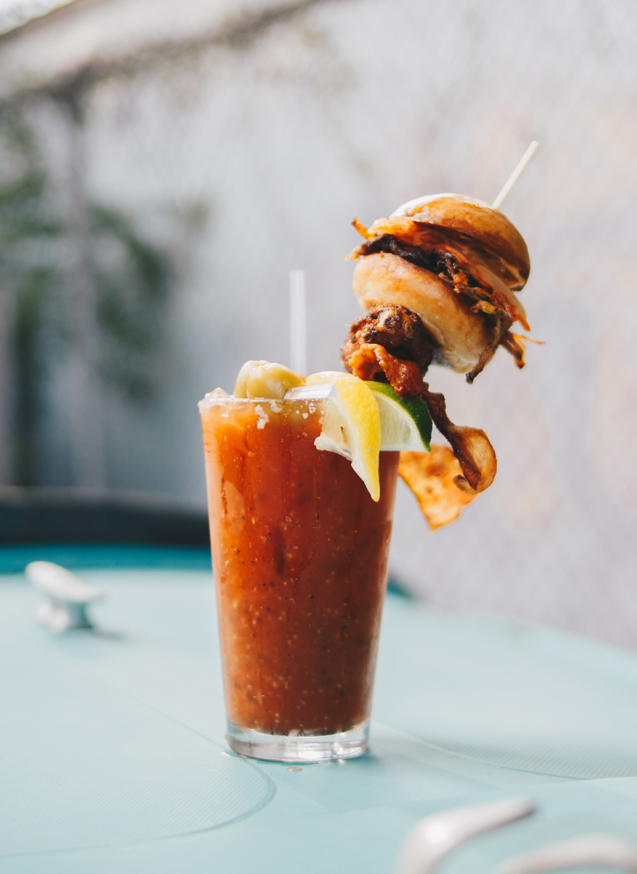 Northside Yacht Club // The bar’s secret bloody mix is infused with Tito’s vodka and citrus juices and then topped with an obscene smörgåsbord of meat: a house breakfast sausage slider on a Sixteen Bricks bun, American hickory bacon, a house-smoked Amish chicken wing and a piece of celery, obviously. 4231 Spring Grove Ave., Northside, northsideyachtclub.com.