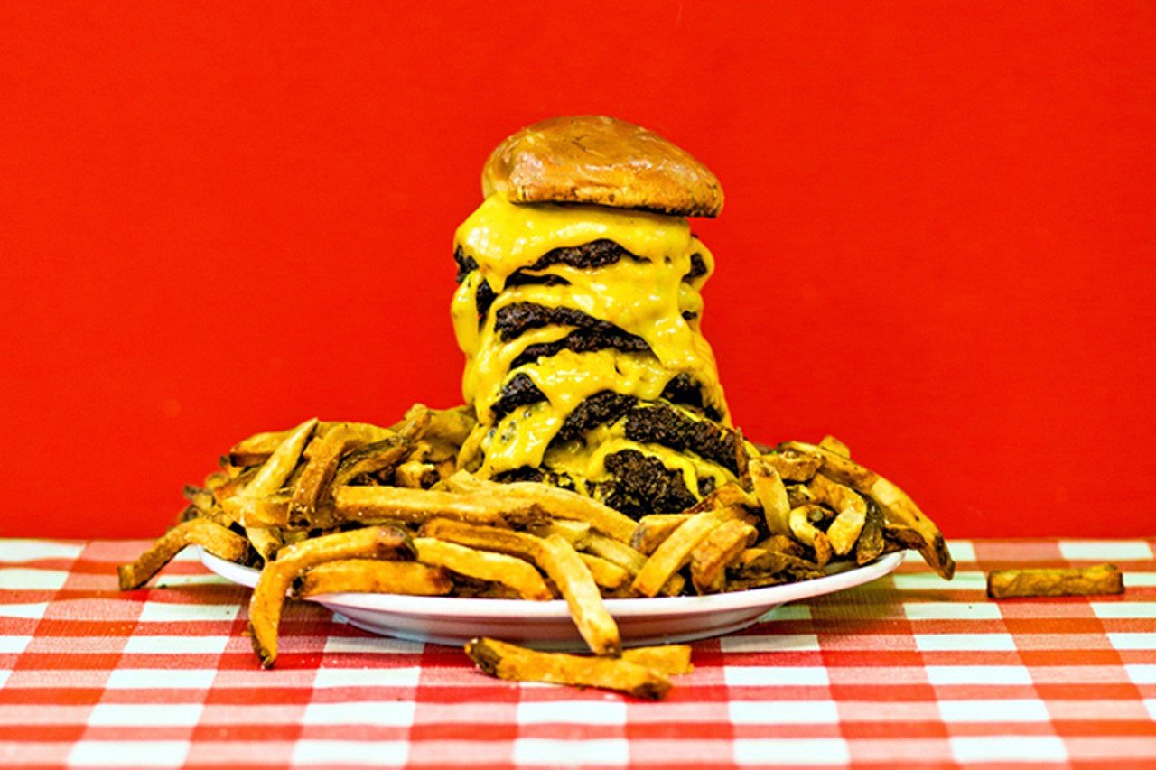 Bardzilla Challenge
Bard&#146;s Burgers, 3620 Decoursey Ave., Covington, 859-866-6017
The Feat: Take on the 11-patty Bardzilla burger, plus a pound of fries and a shake ($40) 
The Time Frame: 60 minutes.
The Bardzilla is back and bigger than ever. If 10 cheesy patties weren&#146;t difficult enough to consume, you now have to finish off 11 &#151; each weighing a third of a pound &#151; to champion this endeavor. The beast of a burger comes complete with extra cheese, lettuce and pickles, plus a pound of fries and a 16-ounce shake. As of August, 100 people had attempted to tackle the Bardzilla, but only three had been successful &#151; although some have come painfully close.
Photo: Hailey Bollinger