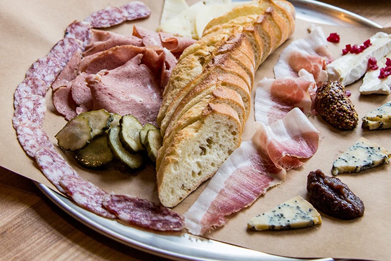 Panino
1313-1315 Vine St., Over-the-Rhine
Nino Loreto's handcrafted cured meats &#151; salumi, mortadella, capicola and more &#151; show up in a starring role on the charcuterie platters at Panino, his OTR eatery and sandwich shop. Sit at the bar and enjoy his meaty art (all sourced from the restaurant's basement curing chamber) paired with a selection of local cheeses and "appropriate accoutrement." ($14-$50)
Photo: Hailey Bollinger