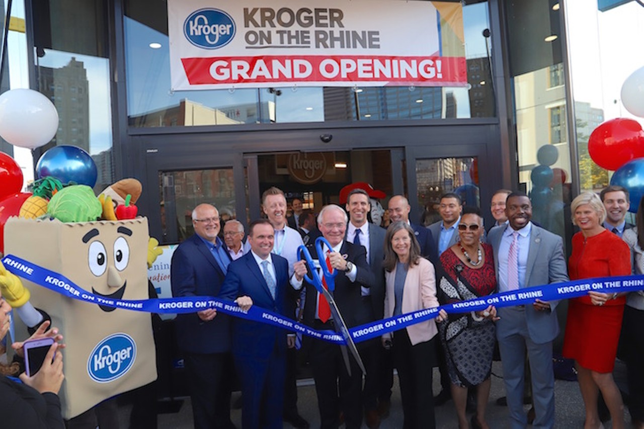 City and county elected officials and Kroger leadership cut a ribbon to signify the opening of the new Kroger on the Rhine location.