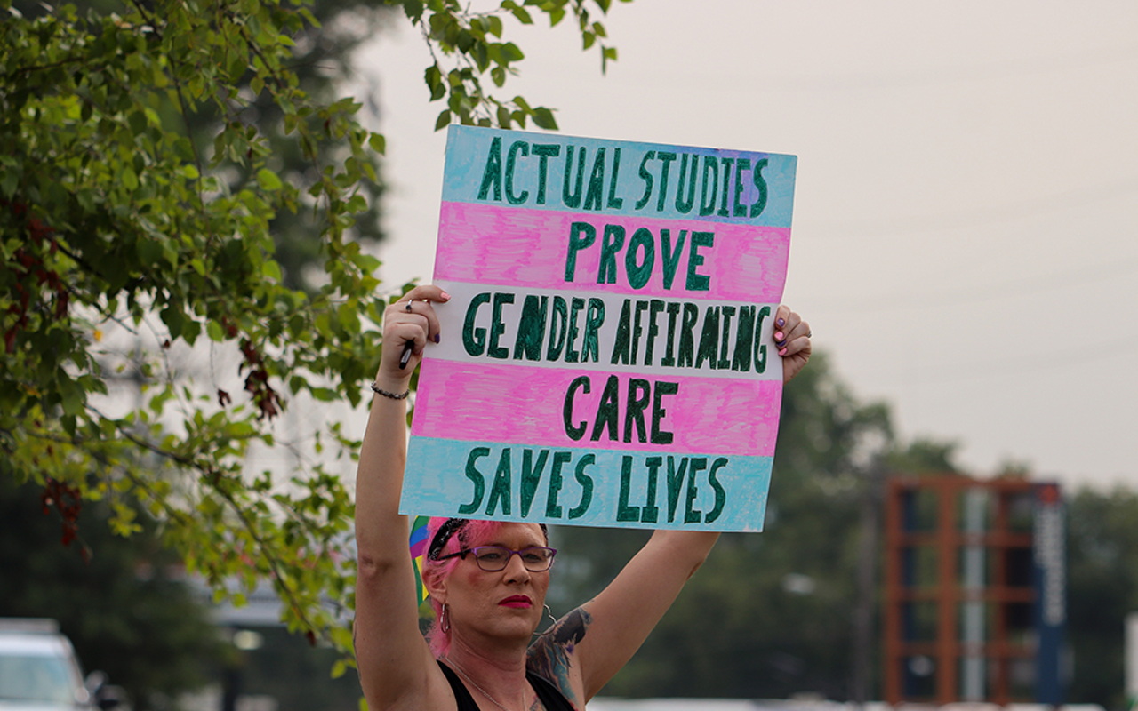 LGBTQ+ allies demonstrate outside Crossroads Church in Oakley on July 25, 2021.