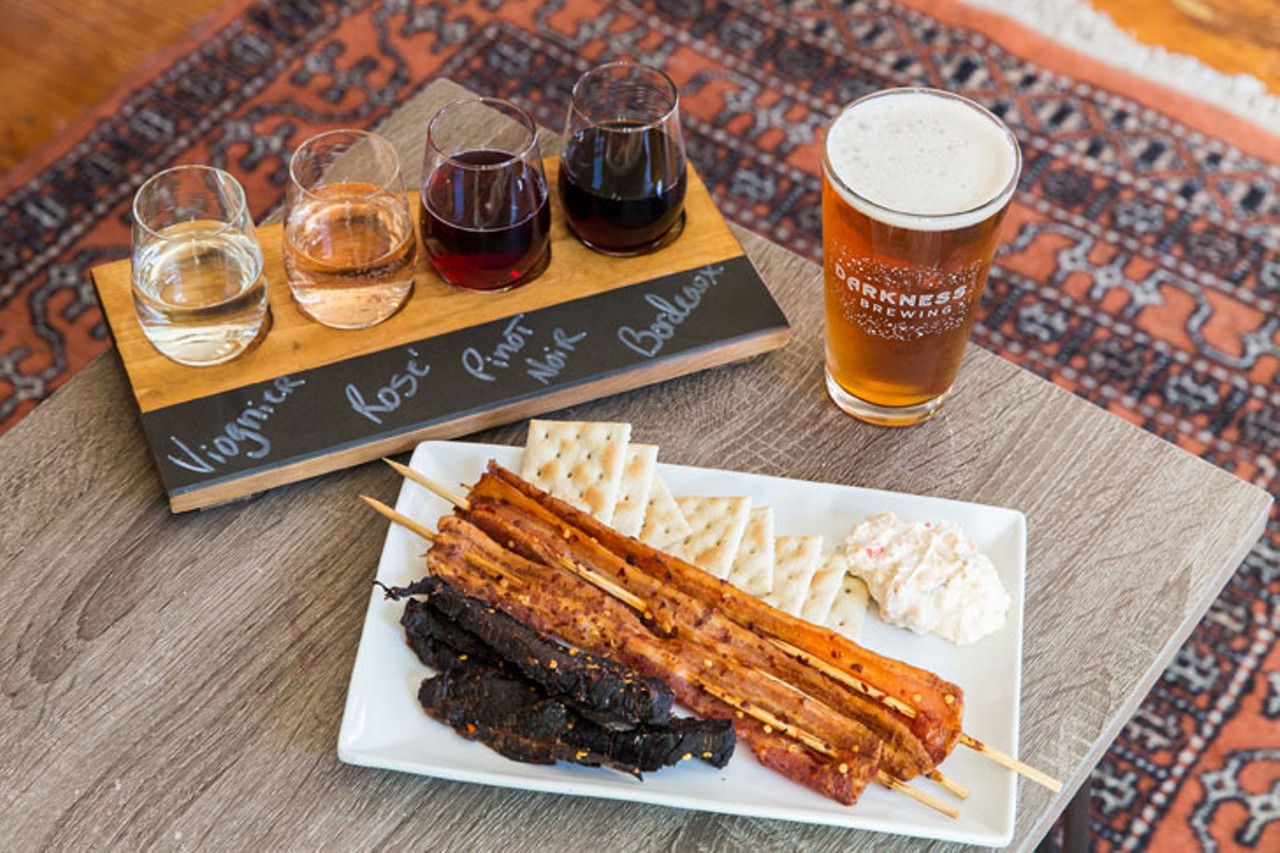 A wine flight, beer and "Truckstop Charcuterie" with housemade maple-Sriracha bacon and beef jerky, plus pimento cheese and saltine crackers
