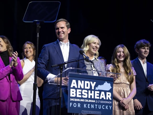 Gov. Andy Beshear, flanked by Lt. Gov. Jacqueline Coleman and his family, takes in the celebration at his reelection party, Tuesday, Nov. 7, 2023, at Old Forrester’s Paristown Hall in Louisville.