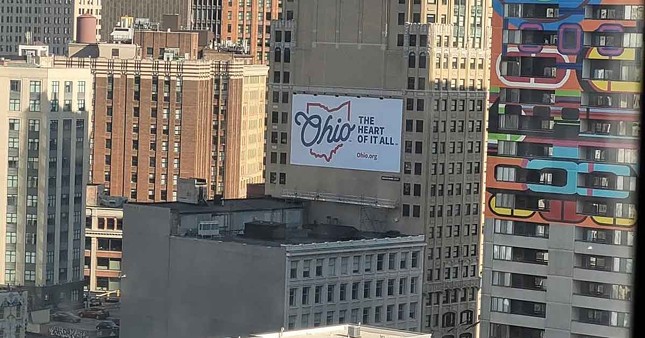 A billboard in Detroit promoting travel to Ohio.