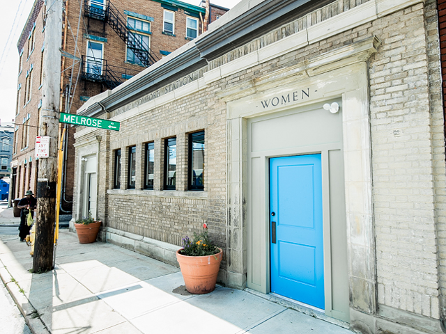 The exterior of Comfort Station — and its signature blue door — in Walnut Hills