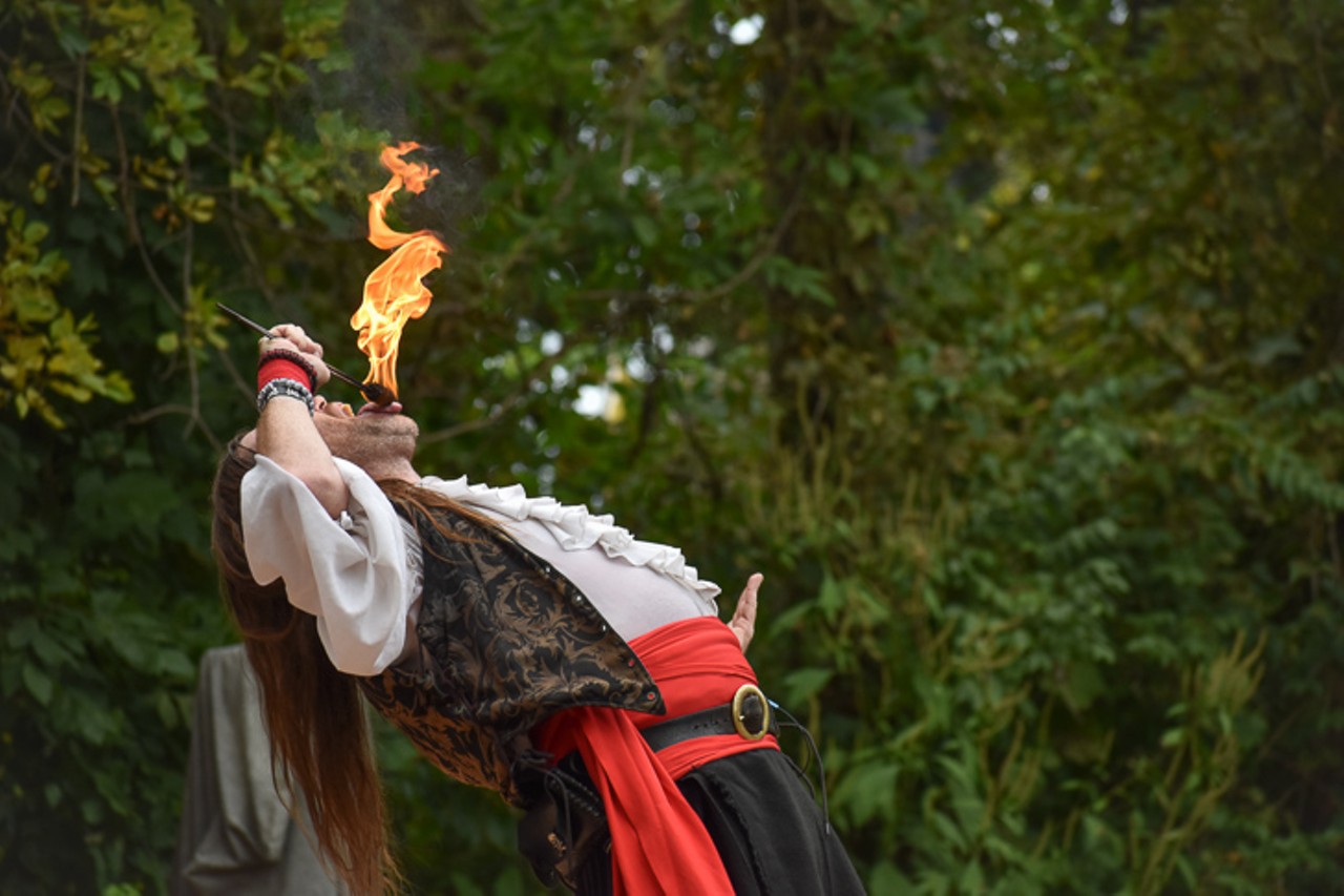 Shantyman of Knotty Nauticals Pirate Show performs a fire-eating stunt