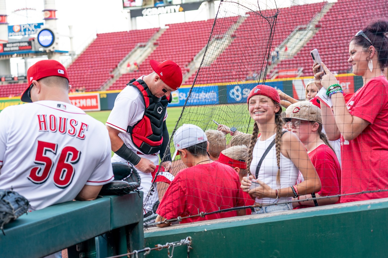 Cincinnati Reds catcher Michael Papierski signs autographs at the Cincinnati Reds' game against the Miami Marlins on July 27, 2022.