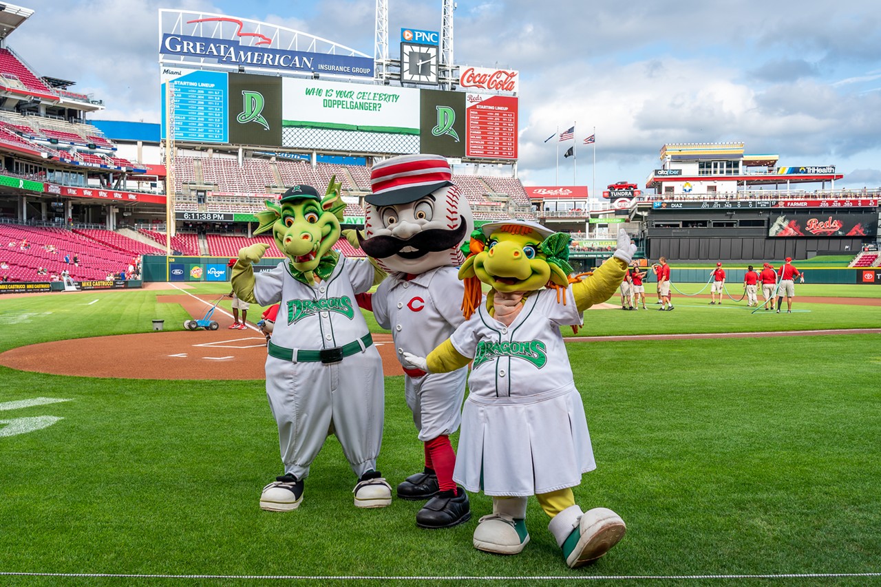 Dayton Dragons mascots meet Cincinnati Reds mascot Mr. Redlegs at the game against the Miami Marlins on July 27, 2022.