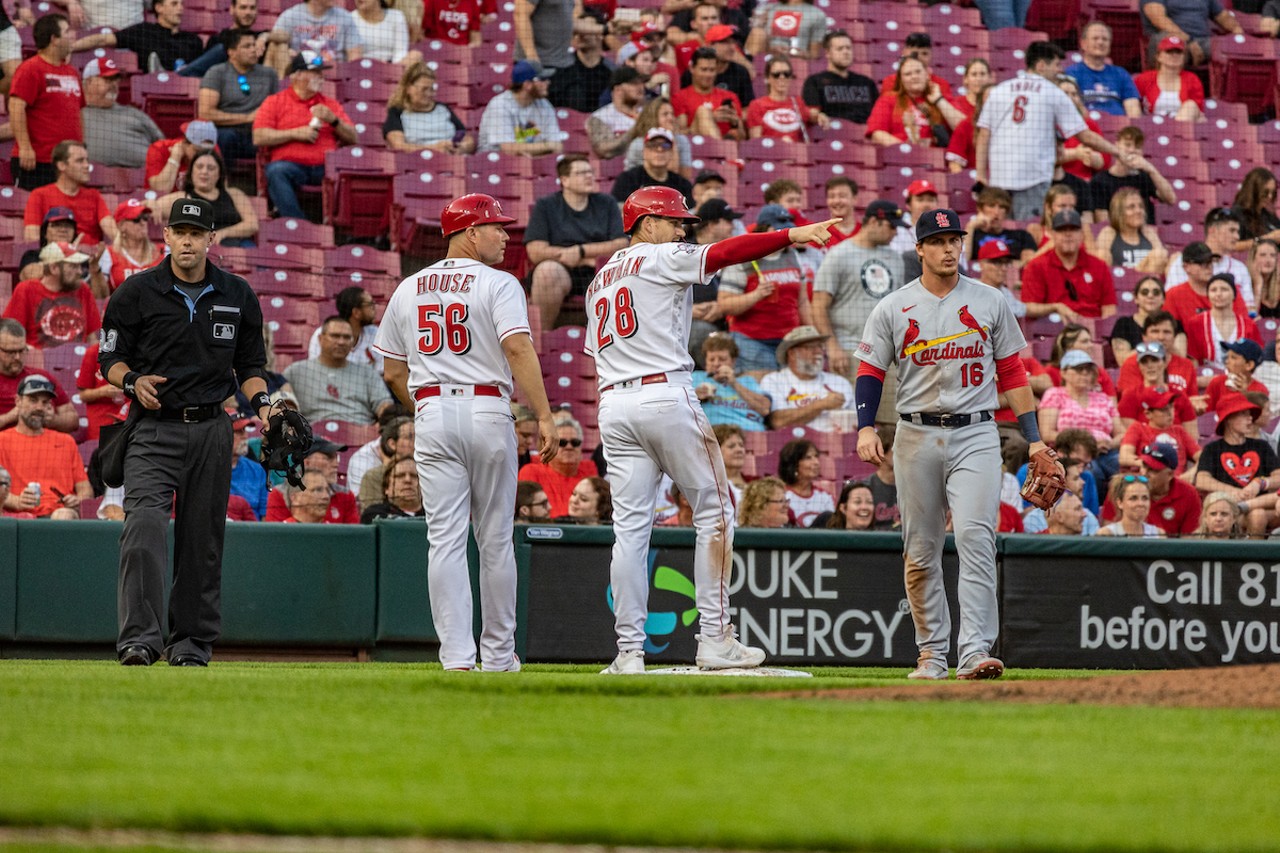 Cincinnati Reds third base coach J.R. House and shortstop Kevin Newman during their game against the St. Louis Cardinals on May 23, 2023.