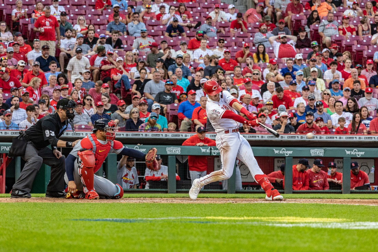Kevin Newman taking a swing during the Cincinnati Reds' game against the St. Louis Cardinals on May 23, 2023.