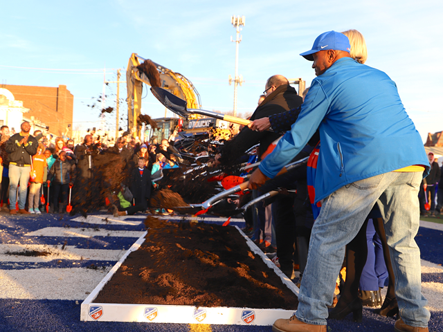 West End Community Council President Keith Blake and other guests throw ceremonial shovels of dirt at the groundbreaking of FC Cincinnati's Major League Soccer stadium