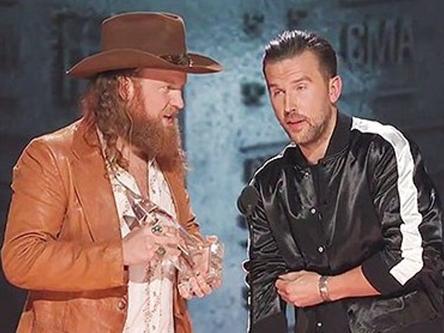 Brothers Osborne collecting their third straight "Vocal Duo of the Year" trophy at the 2018 CMAs