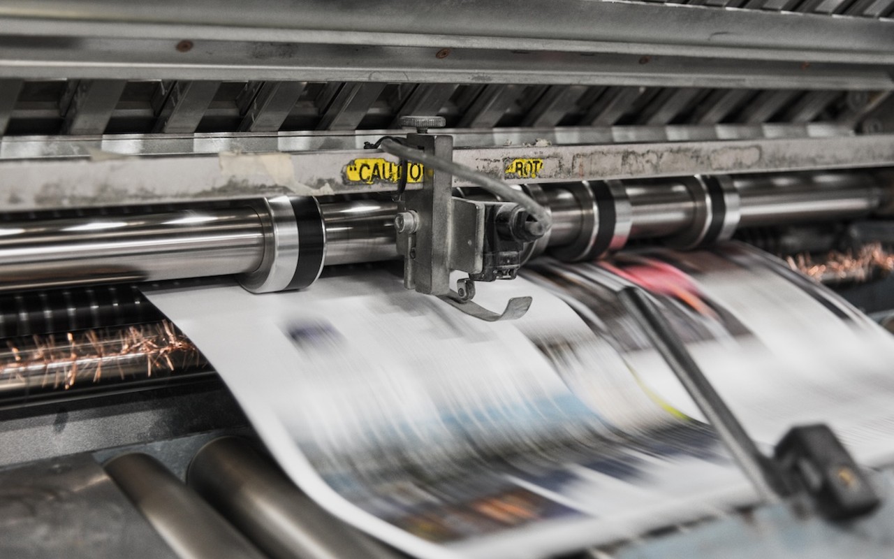Marty Schladen pens a commentary about how the newspaper industry has changed in the past century