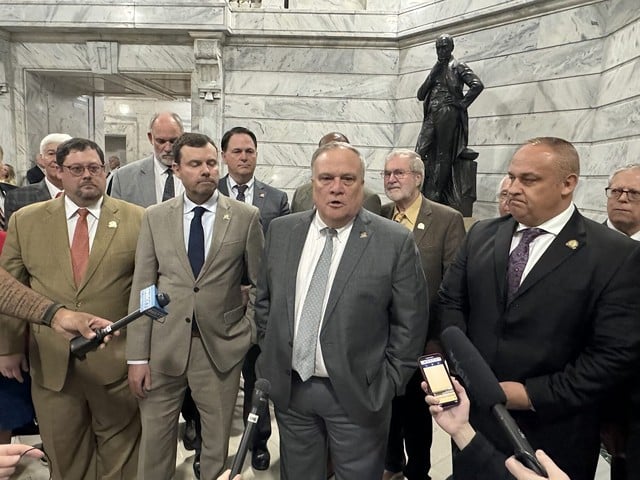 Men of the legislature gathered with Senate President Robert Stivers to talk to media after overriding Gov. Andy Beshear’s veto of a bill that preempted housing discrimination ordinances in Louisville and Lexington.