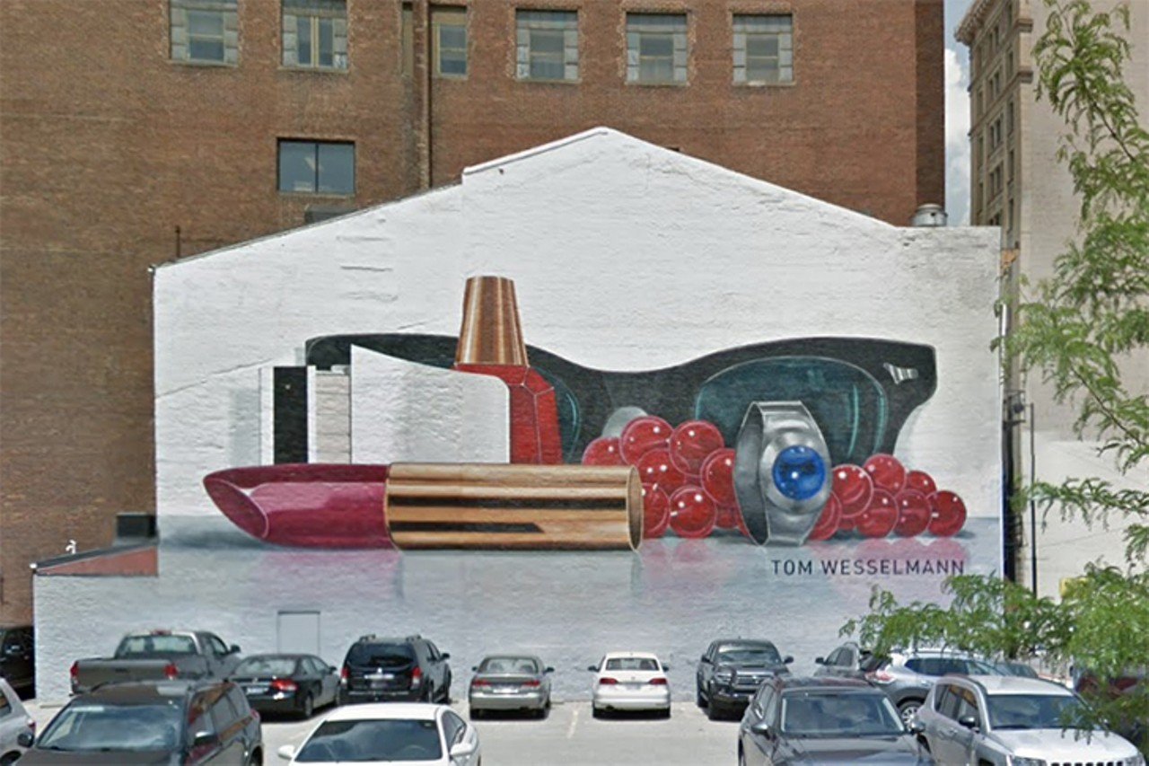 Tom Wesselmann, Still Life #60 mural
811 Main St., Downtown
Of all the murals that Barbie could pose in front of in Cincinnati, it would be the giant lipstick at 811 Main St. Tom Wesselmann’s Still Life #60 is a billboard-sized still life painting composed of six separate shaped canvas panels. According to ArtWorks, Wesselmann was born in Cincinnati and attended both the University of Cincinnati and the Art Academy before moving to New York City. The hot pink lipstick, the ring peering at the audience in front of a pair of sunglasses. Barbie gets it.