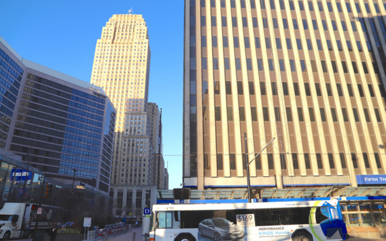 A Metro bus drives through downtown Cincinnati.