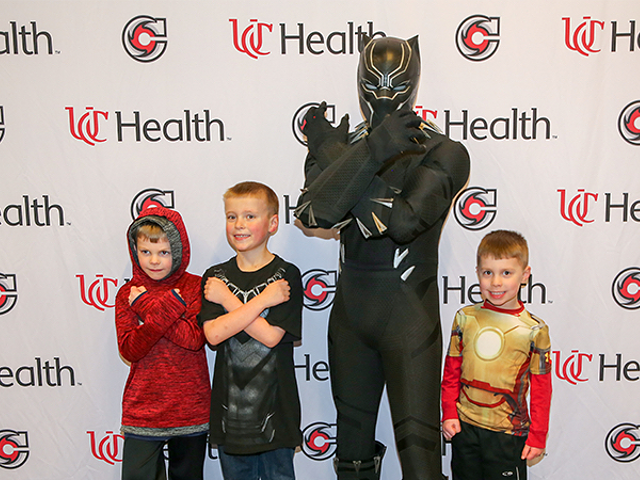 Black Panther hangs with some young Cyclones fans