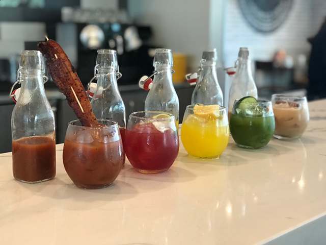 The line-up of new drinks, including a bloody with a big-ass piece of bacon in it (left)