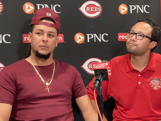 Pitcher Luis Castillo (left) and translator Jorge Merlos discuss Castillo's trade from the Cincinnati Reds to the Seattle Mariners on July 29, 2022.
