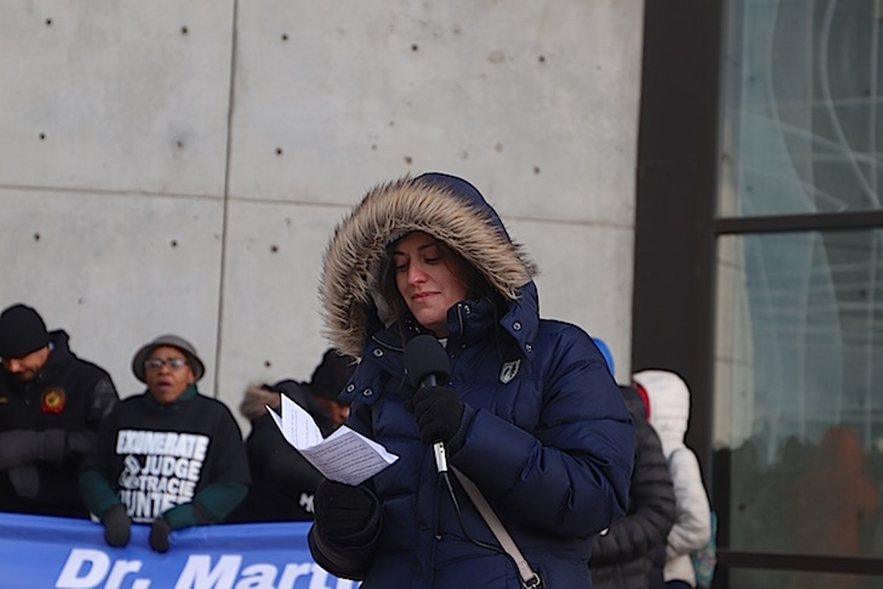 Episcopal Church of the Redeemer's Rev. Melanie W. J. Slane reads a prayer before the MLK Day march to Fountain Square