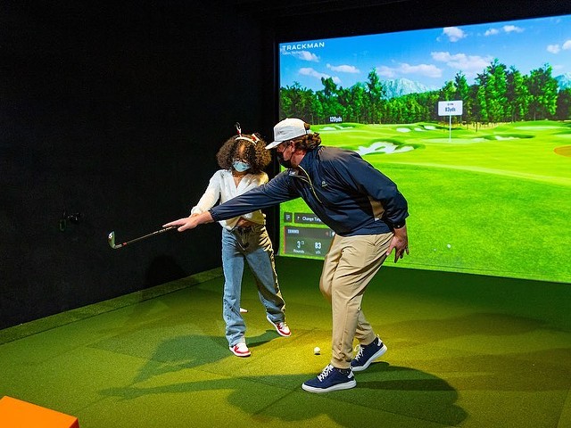 Five Irons Golf indoor golf simulator.