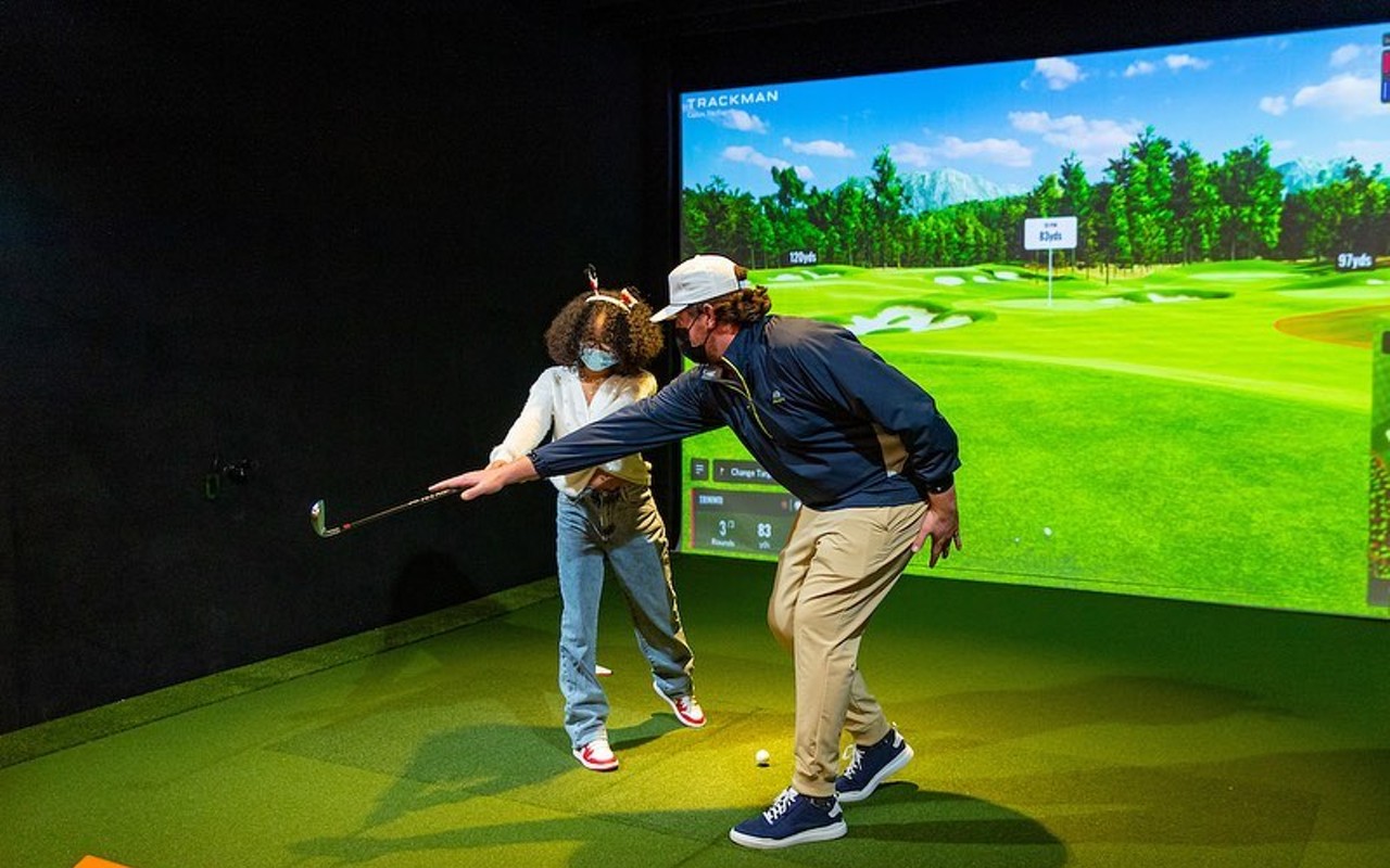 Five Irons Golf indoor golf simulator.