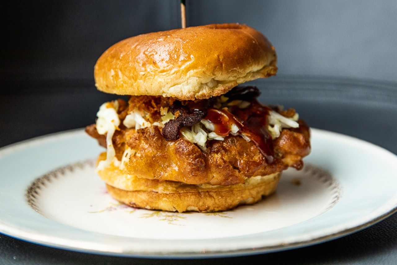 'Hell Ya" Chicken Sandwich ($9) with house-brined fried chicken, pimento cheese, pineapple slaw, sweet and spicy bacon, BBQ sauce and pickles