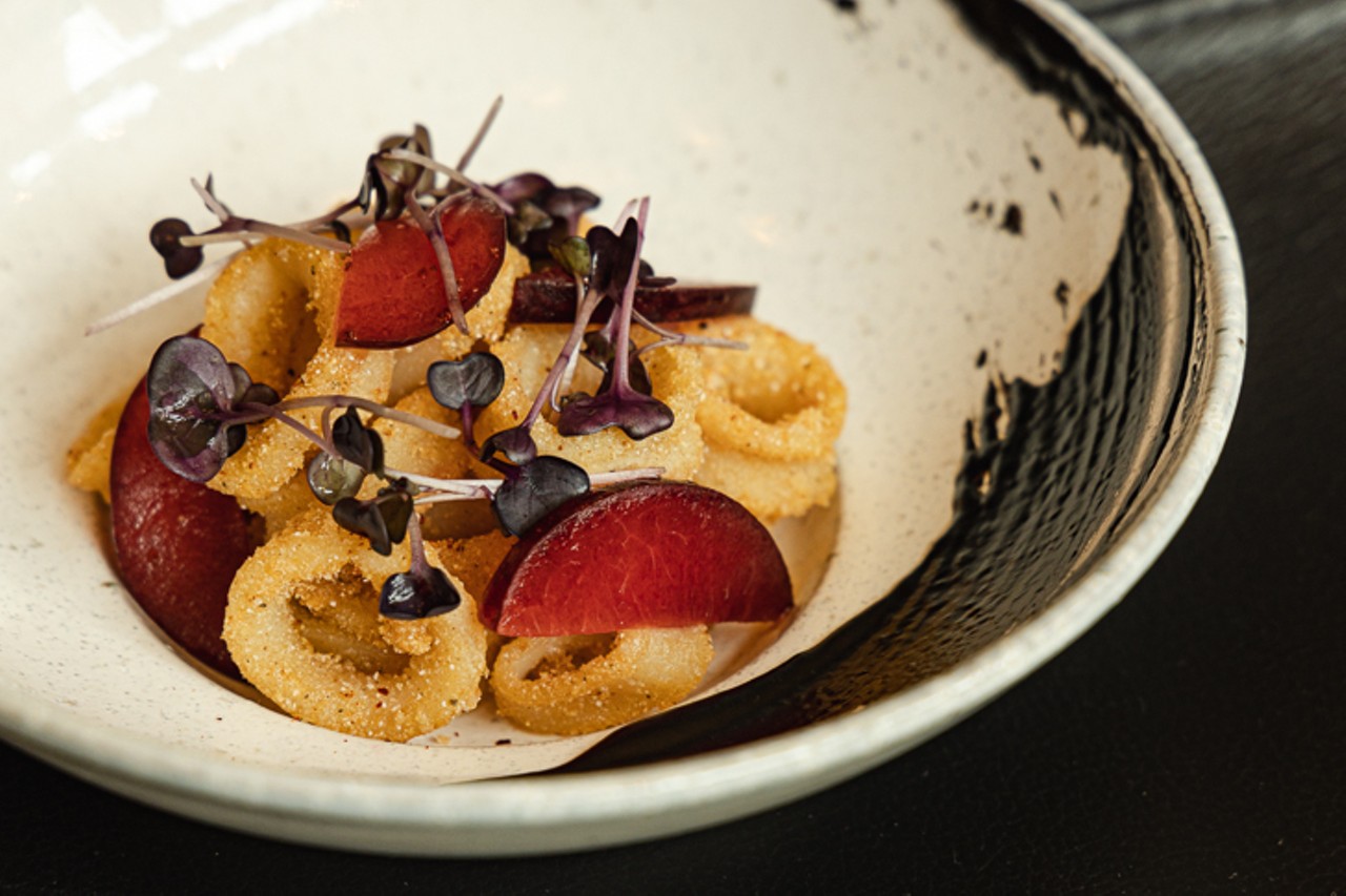 Cornmeal-fried calamari with pickled plums, ink and radish sprouts
