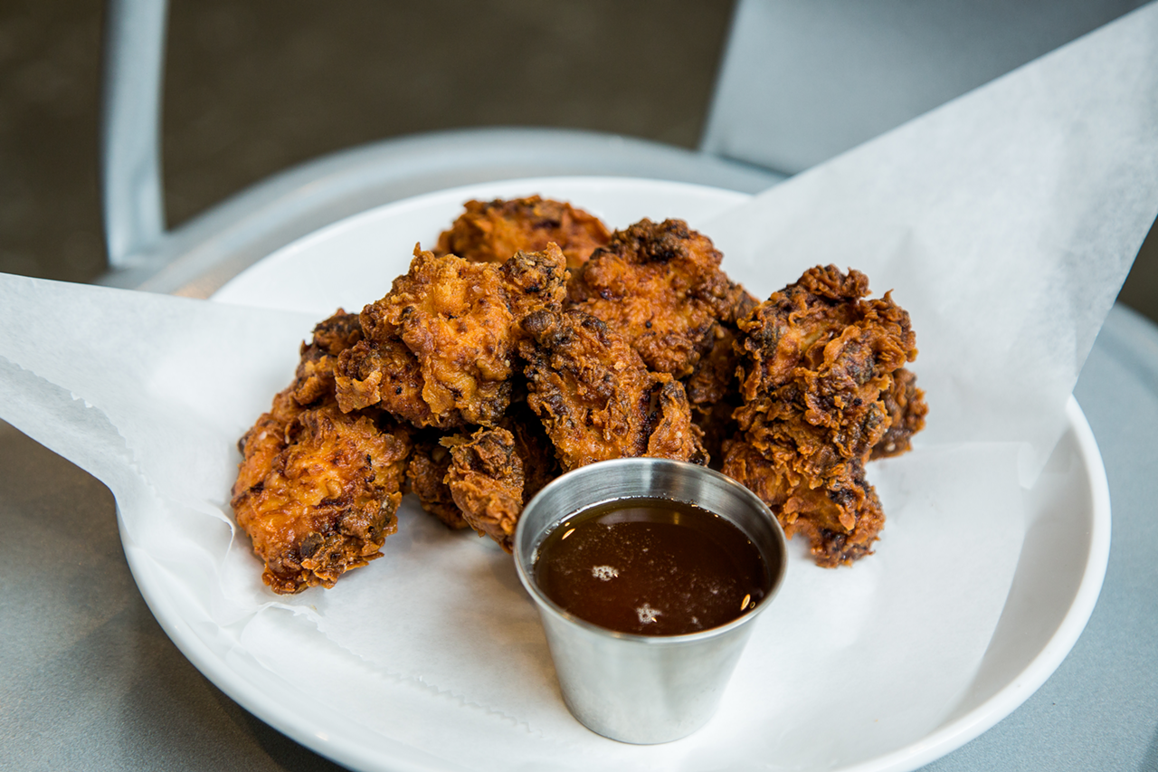 Fried chicken gobbets — aka "adult chicken nuggets" — served with hot honey sauce