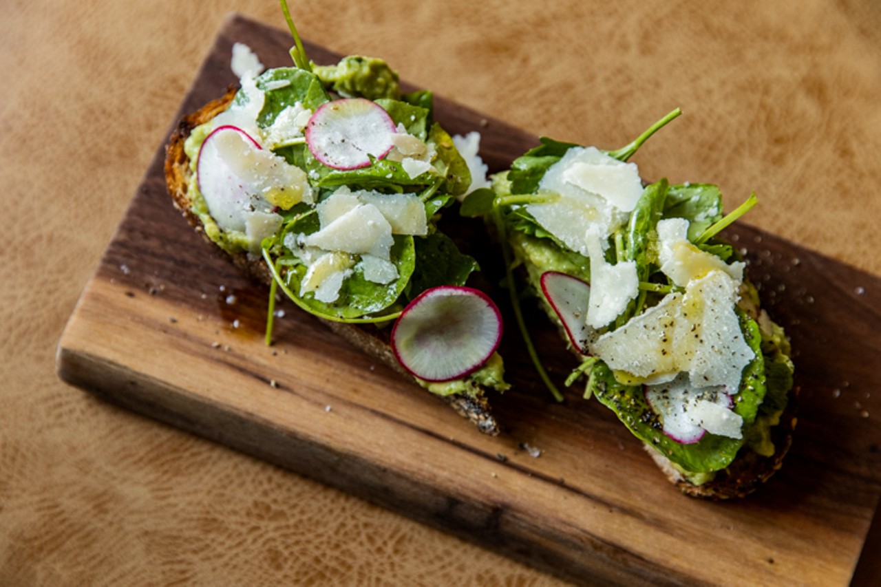 Crushed avocado toast with shaved radish, pickled jalapeno, parmesan and fresh herbs on multigrain bread ($9)