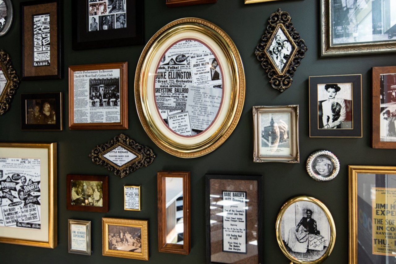 A wall of historic photographs and articles from past local Jazz lounges