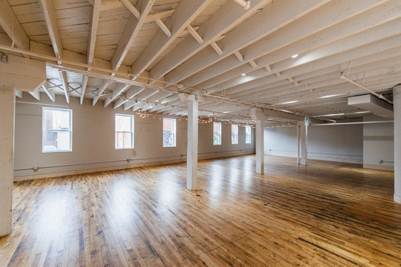 "The maple wood floors are all original to the building. Some areas have wider plank than others because portions of the building were constructed at different times. Because of significant termite damage throughout the building, we spent weeks salvaging floors from areas that would be covered to reuse them in the main space and then harmoniously refinished the entire room." &#151;&nbsp;Sarah Thomas