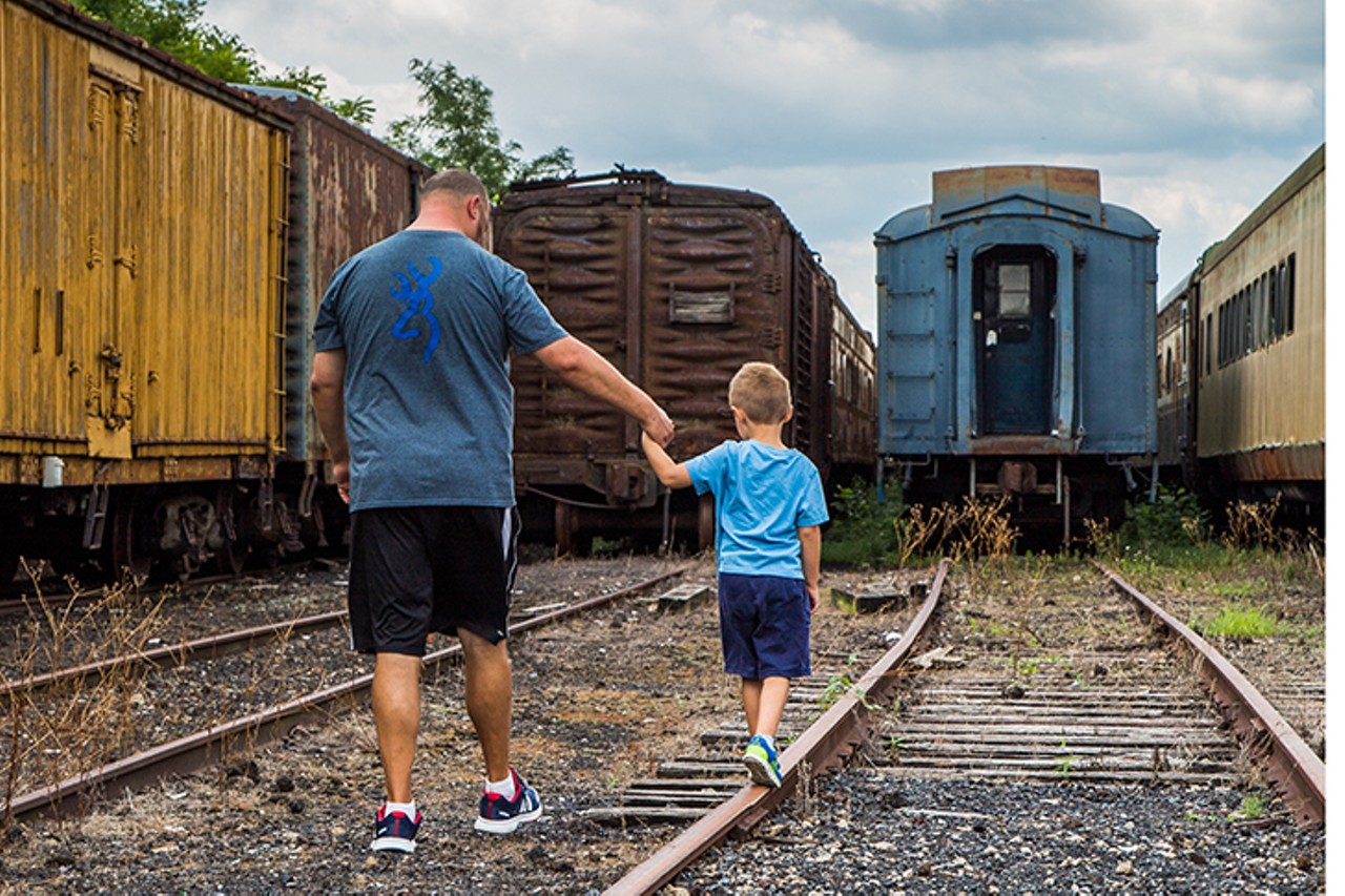 Family exploring the train yard