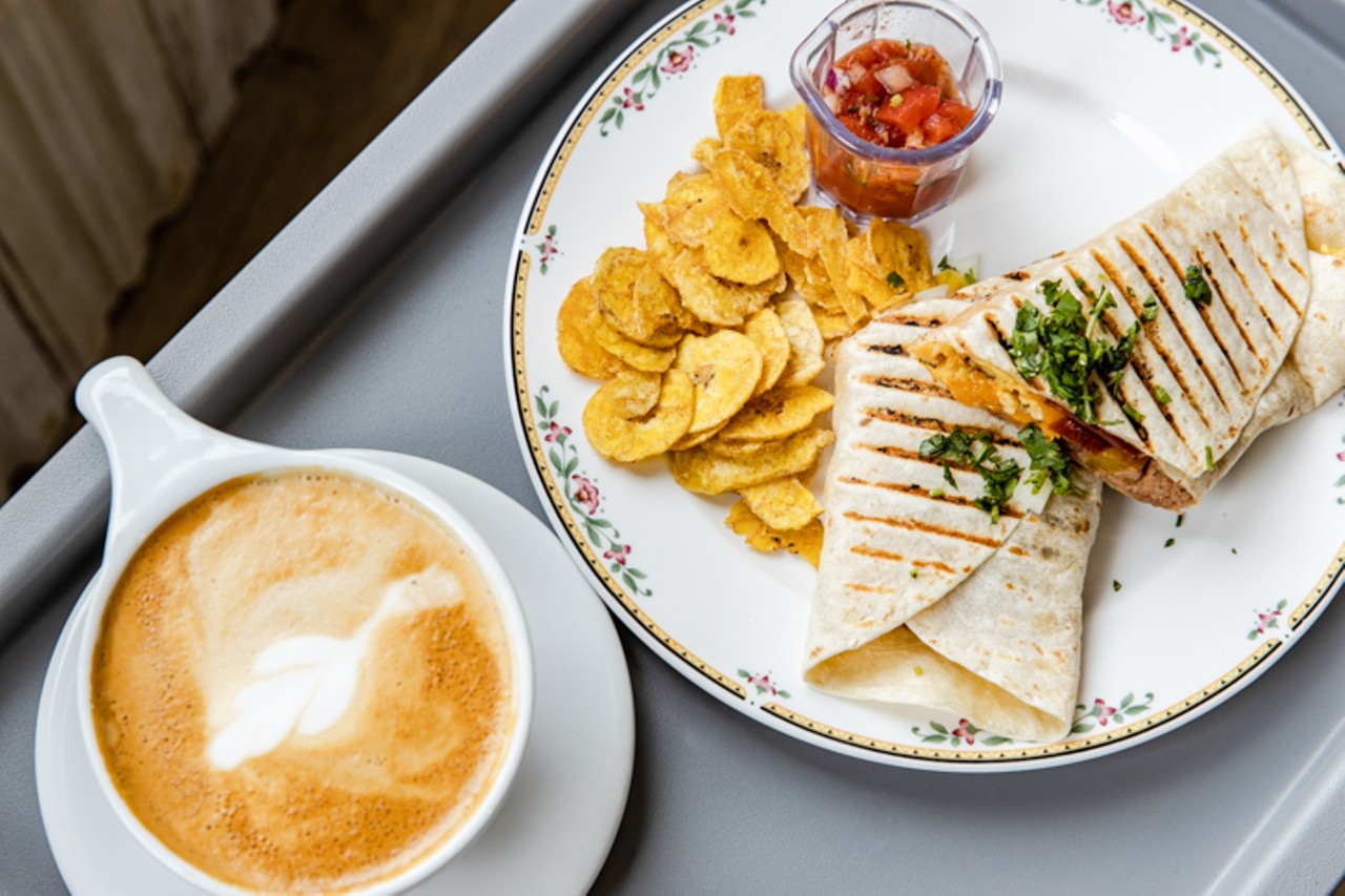 The Tacoma Taquito (scrambled eggs, refried beans, grilled peppers and onions, cheddar cheese, flour tortilla, diced onions, cilantro, turkey bacon) and cappuccino