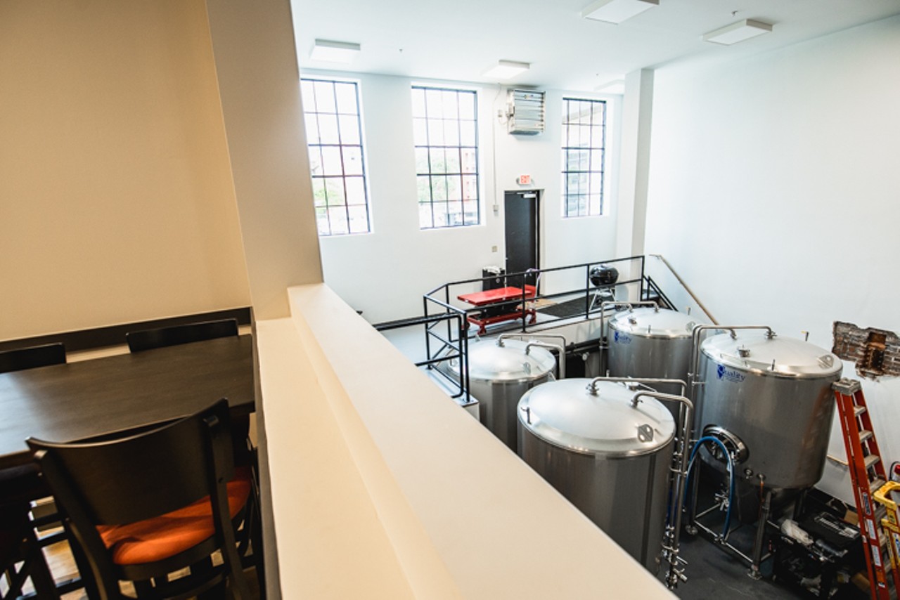 Because the brewing equipment is housed in the basement, a viewing space is carved out so customers can look down into the brew hub.