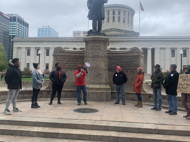 About 20 people protested against Senate Bill 83 outside of the Statehouse on May 3, 2023.