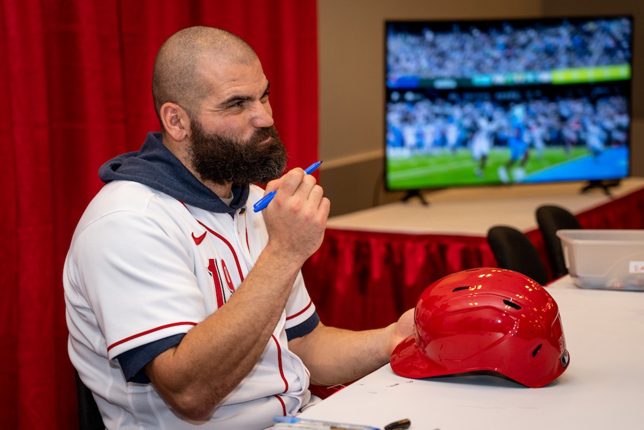 Cincinnati Reds first baseman Joey Votto signs items during Redsfest, held at Duke Energy Center downtown on Dec. 2-3, 2022.