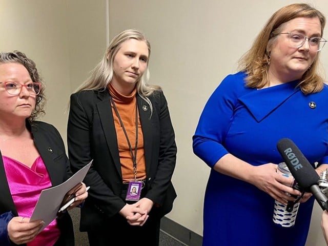 In the middle of the hearing, three Democratic members of the committee walked out of the Annex meeting room in protest of the bill. Reps. Lindsey Burke, right, Rachel Roarx, center, and Adrielle Camuel, left.