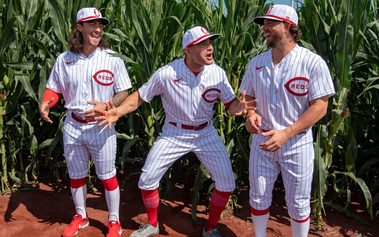 Cincinnati Reds players Jonathan India (left), Joey Votto and Kyle Farmer get corny before the MLB Field of Dreams game against the Chicago Cubs in Dyersville, Iowa, on Aug. 11, 2022.