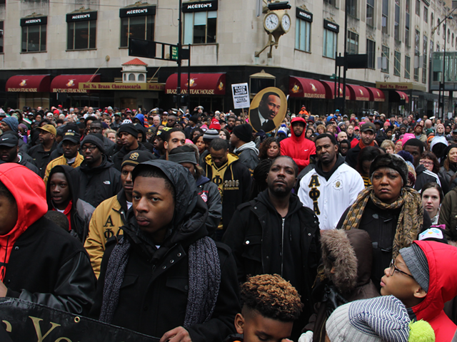 Marchers gather on Fountain Square in remembrance of Martin Luther King, Jr.