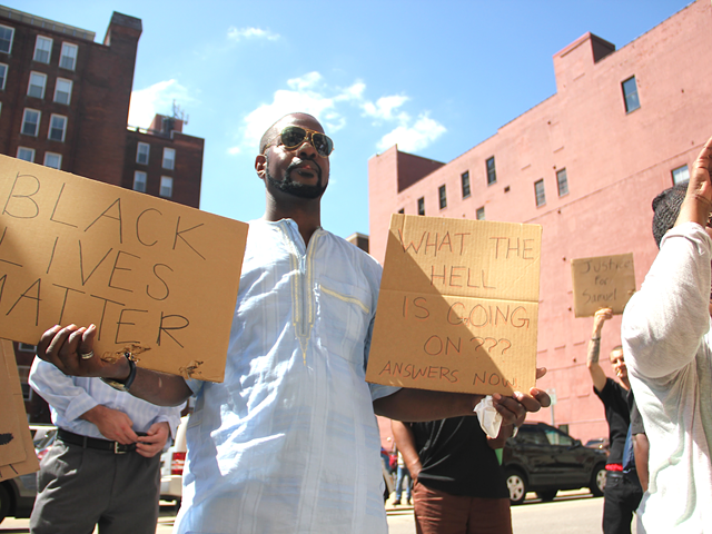 Protesters outside the Hamilton County Prosecutor\'s office demand release of evidence in Samuel Dubose shooting
