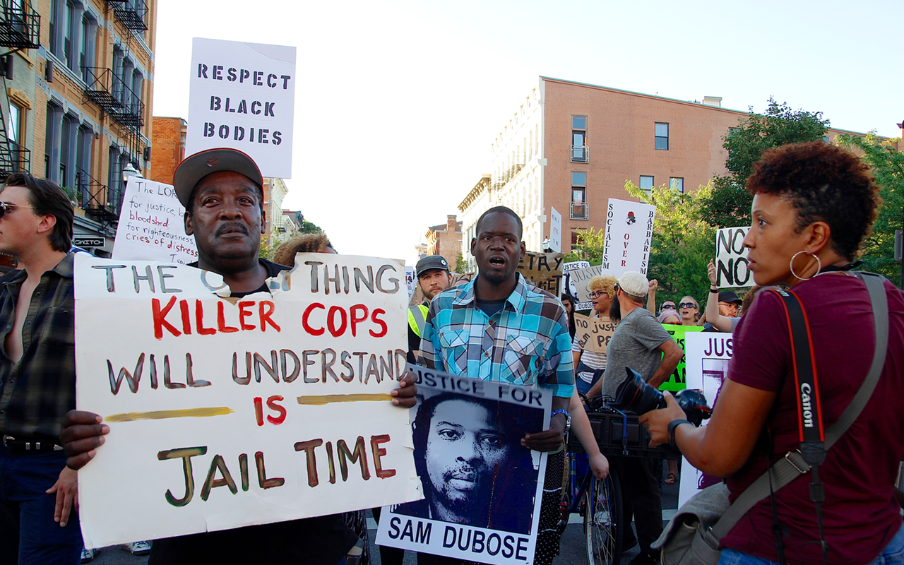 Protesters march along Vine Street Saturday in memory of Sam DuBose