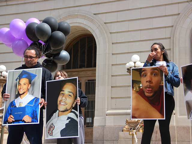 Family of slain Kevin Neri protests a potential plea deal for his shooter Earl Jones outside the Hamilton County courthouse.